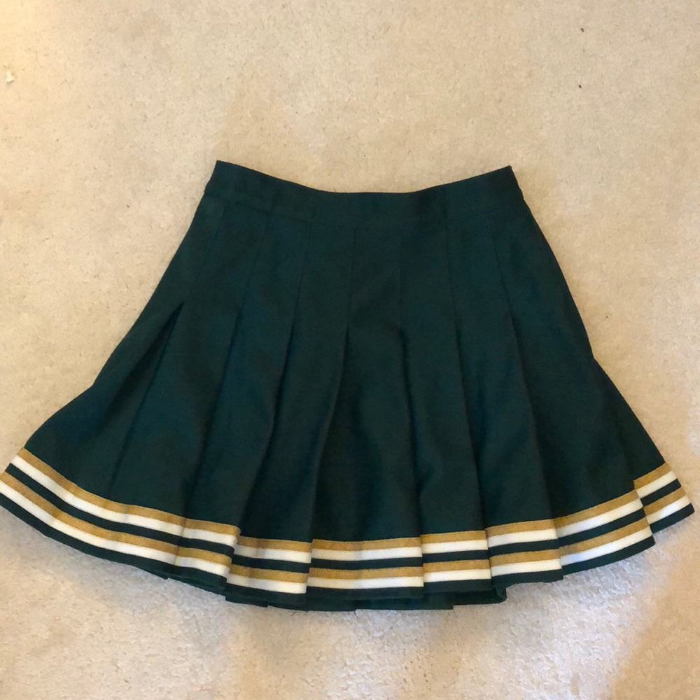 Green, white, and gold cheer skirt.